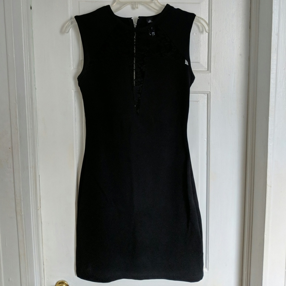 Black dress with lace detail.